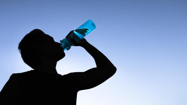 Man drinking water. Stay hydrated. 