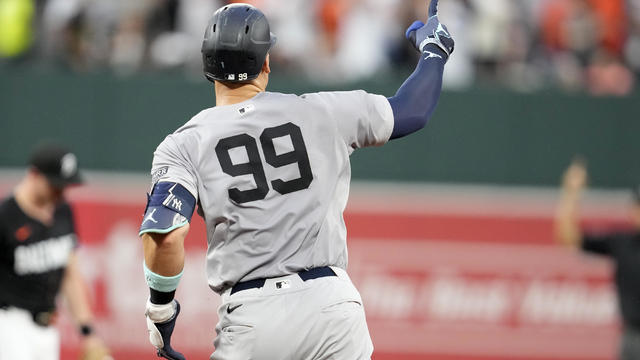 Aaron Judge #99 of the New York Yankees celebrates after hitting a solo home run in the third inning during a baseball game against Baltimore Orioles at the Oriole Park at Camden Yards on July 12, 2024 in Baltimore, Maryland. 