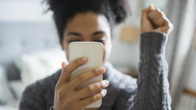 Woman using a cellphone to check social media 