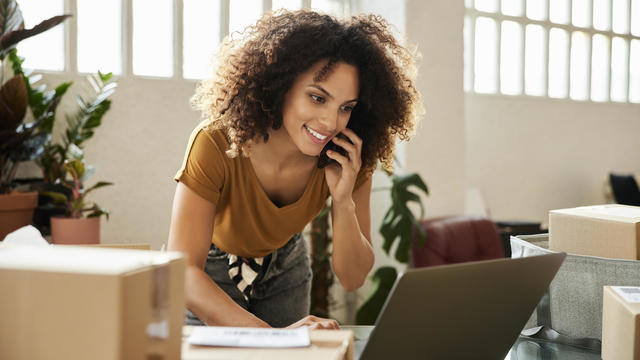 Entrepreneur Using Laptop At Home Office 